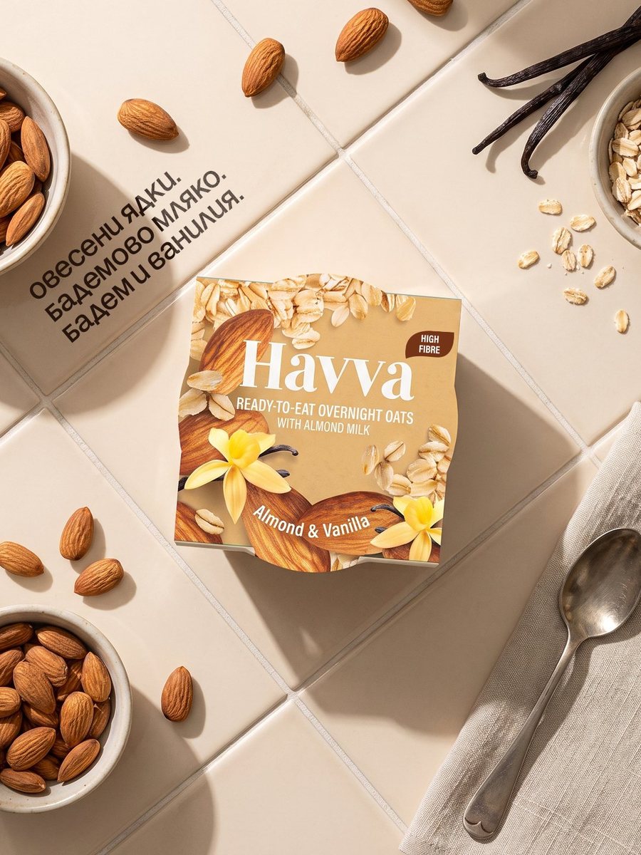 Havva Almond & Vanilla pot with almonds, oats and vanilla pods on cream tiles